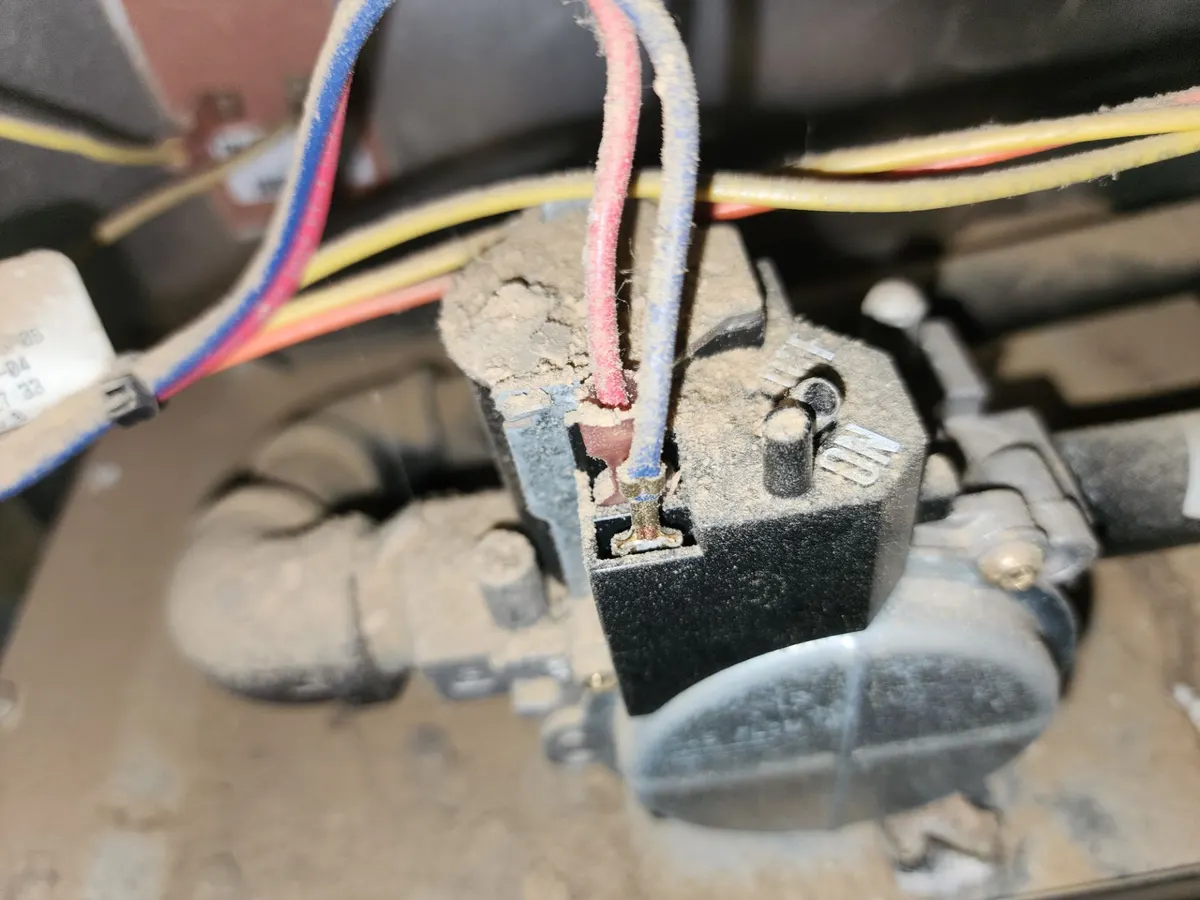 Furnace gas valve and wiring covered in thick dust inside the burner compartment