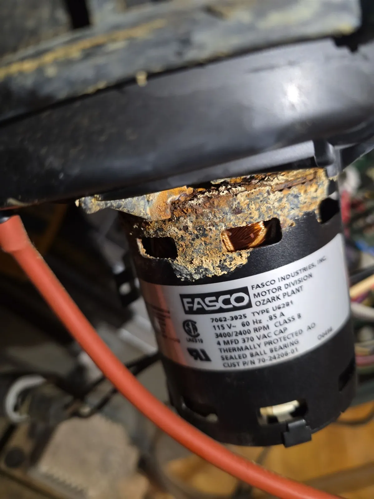 Rusted and corroded furnace inducer motor before replacement