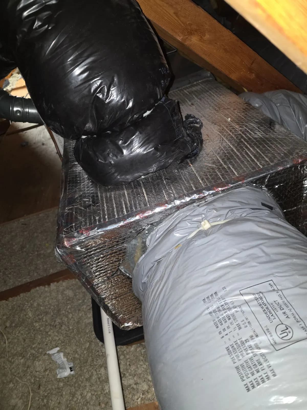Attic supply plenum with flex duct connections resealed and secured